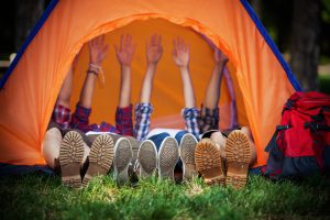 Happy Campers Lying in a Tent